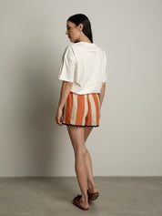 Shorts righe  arancio orli neri