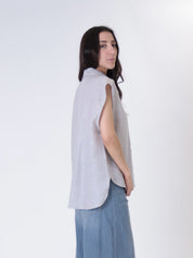 Sleeveless shirt with sequined pearl pocket