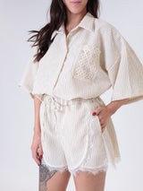 Beige striped shorts with lace trim