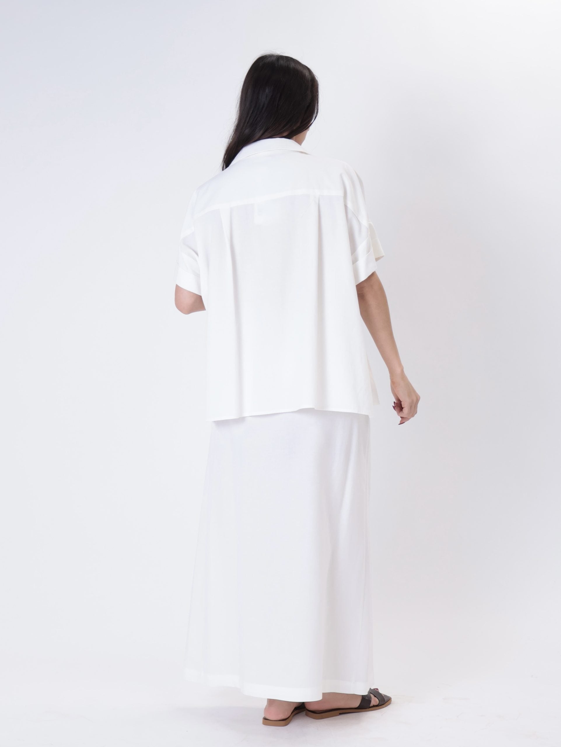 White flowing suit