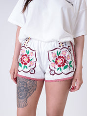 White embroidered flower shorts