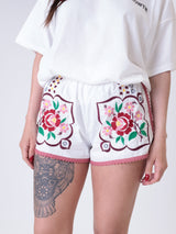 White embroidered flower shorts