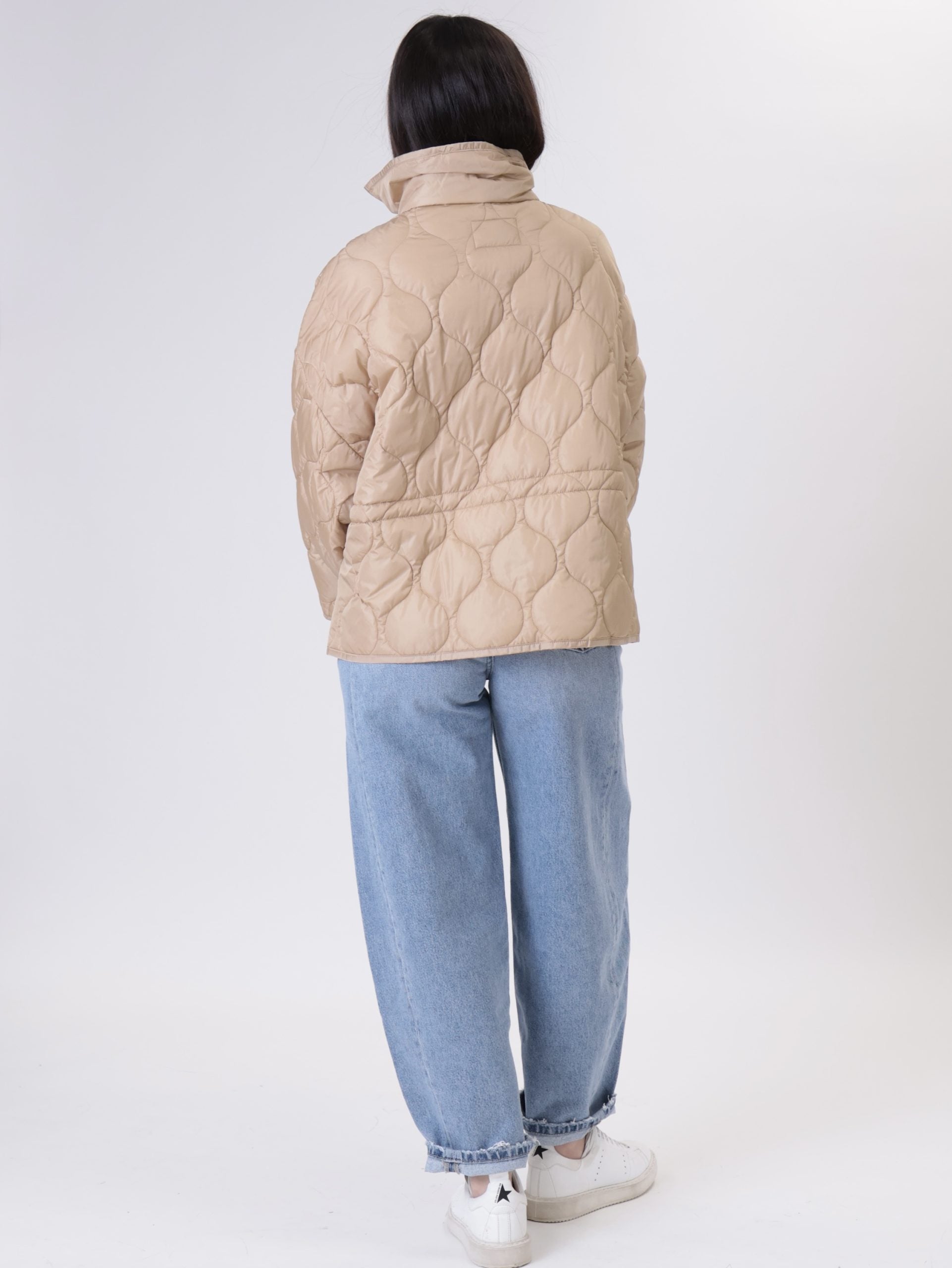 Piumino colletto beige