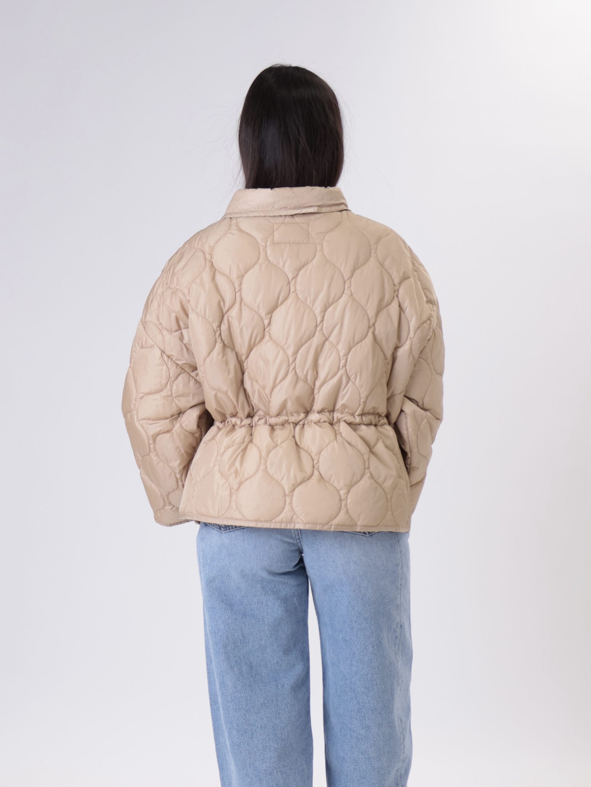 Piumino colletto beige
